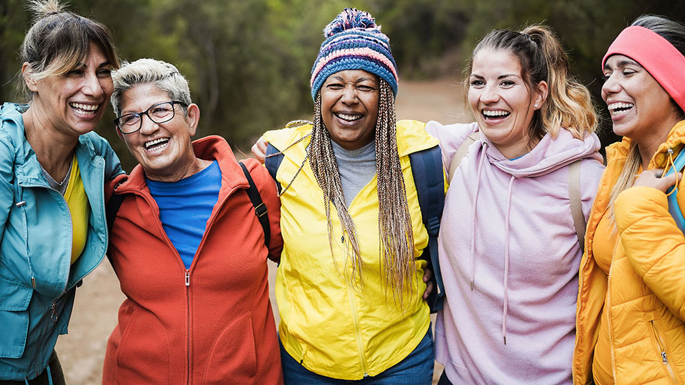 Women smiling in park
